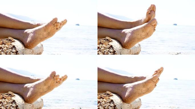 CU赤脚女人的脚在沙子里