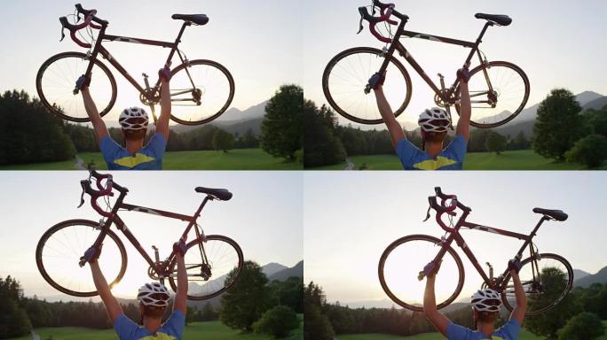特写: 明亮的傍晚阳光照亮了手持公路自行车的胜利男子