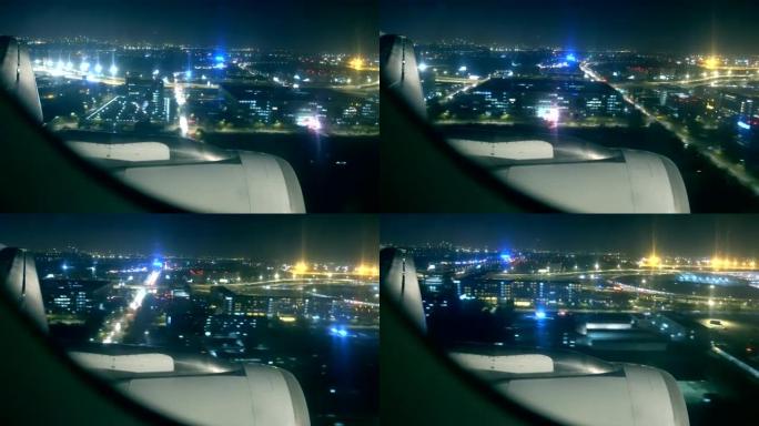 飞机在夜间飞越城市