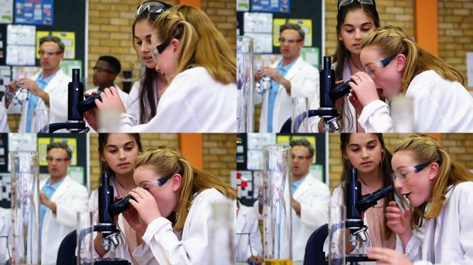 小学生在显微镜上做实验4k