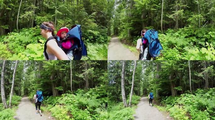 母亲在森林中行走时用背带背包背着婴儿4k