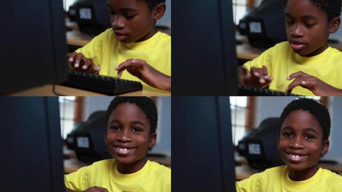 小男孩在电脑课上对着镜头微笑