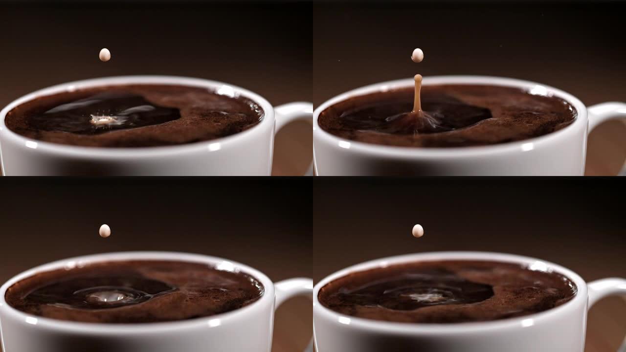 一滴牛奶漂浮在一杯咖啡上的SLO MO电影胶片