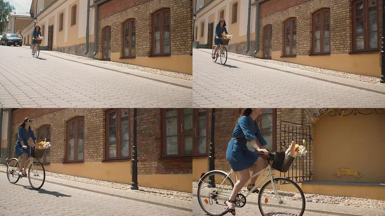 穿着裙子的漂亮女孩走在街上，骑着自行车，篮子里放着鲜花，在夏天，全高清