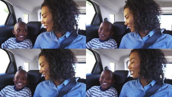 年轻的黑人母亲和男孩在汽车上进行公路旅行
