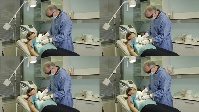 私人皮肤病学诊所的外科医生关闭美容激光痣去除术