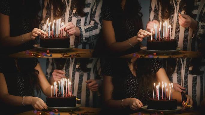 两个女孩用蜡烛准备生日蛋糕。惊喜派对庆典。朋友在一起。节日气氛团结4K