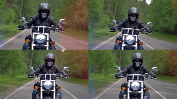 一个骑摩托车的人，骑摩托车的人在一个孤独的道路上驾驶着一个骷髅面具。4 k。