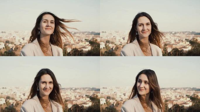 站在意大利罗马全景上的快乐微笑女人的肖像。女性看着相机，享受这一天
