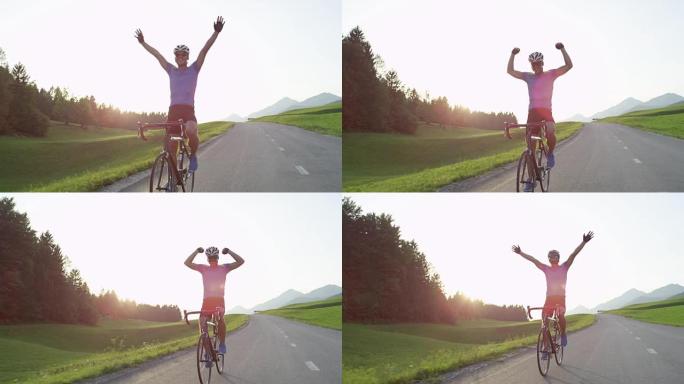 慢动作: 职业自行车手在胜利后愉快地骑着公路自行车。