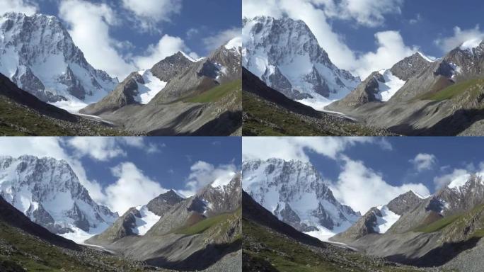 雪山、云彩、蓝天的景观。吉尔吉斯斯坦天山