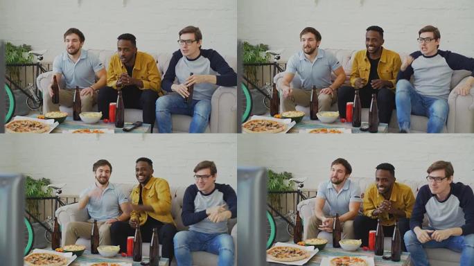 一群年轻的男性朋友在家里喝啤酒和吃零食的时候一起在电视上看体育比赛
