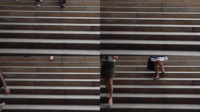 在市区办公中心楼梯上行走的人们的4k镜头，商业和营销概念
