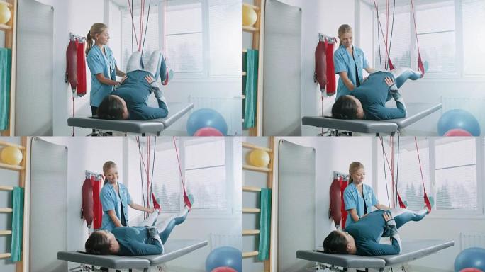 物理治疗师协助受伤的女性患者，在特殊的悬挂绳索系统上进行康复理疗。缓解背痛。现代诊所使用最先进的康复