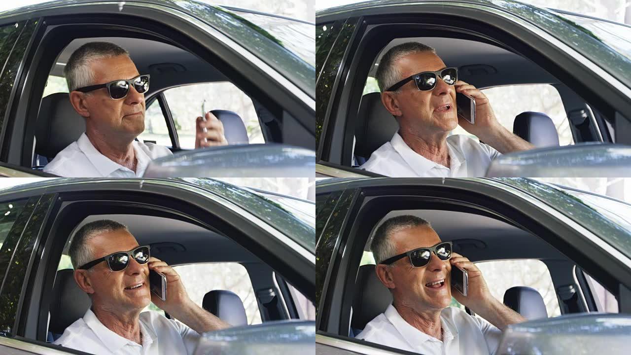 资深男子在车上用手机说话