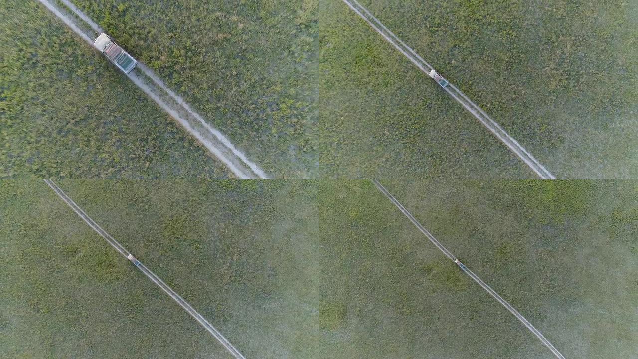 从空中俯瞰一辆游猎汽车穿过博茨瓦纳的草原