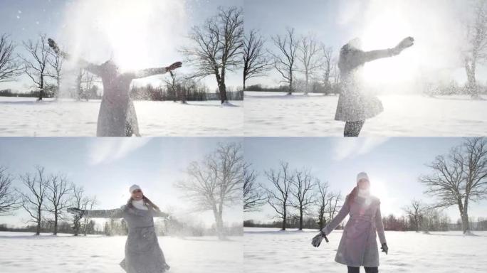 慢动作: 快乐的年轻女子玩雪