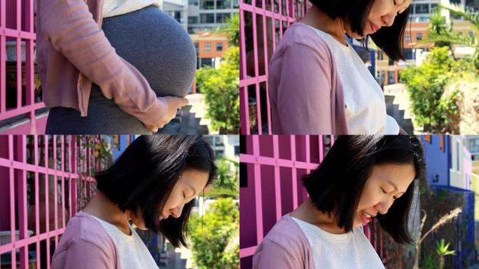 孕妇在4k街附近摸肚子
