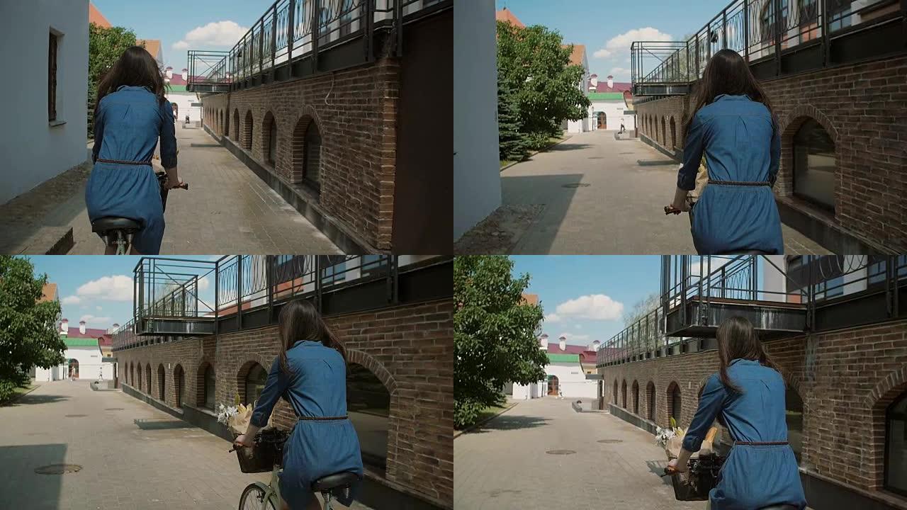 夏天，一个穿着裙子的女孩骑着自行车，篮子里放着花，在街上，慢镜头