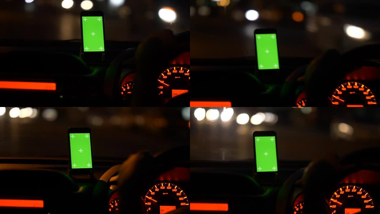 汽车上的数字显示: 人们在晚上使用智能手机