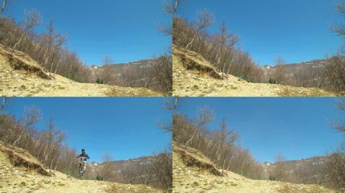 高清: 山地车手跳过相机