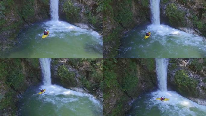 空中: 皮划艇运动员向汹涌的白水瀑布的跳水池划桨