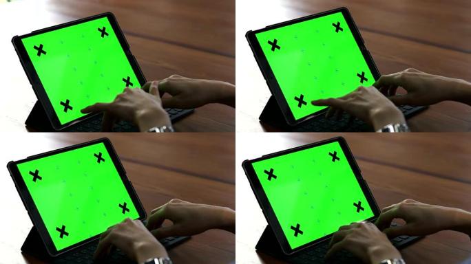 数字平板电脑绿色屏幕的女人打字键盘