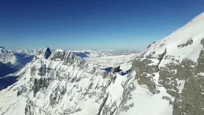 Aerial view of snow covered mountain range with be