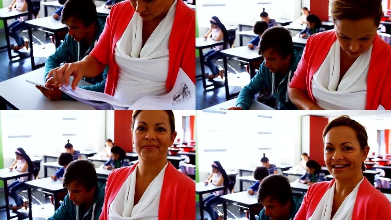 当学生在教室中使用数字平板电脑时，教师阅读书籍
