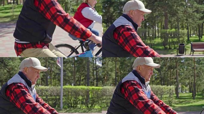活跃的养老金领取者在公园骑自行车