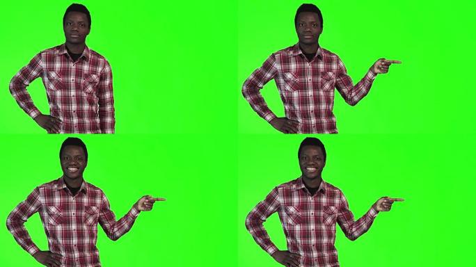 非洲男子指着绿色