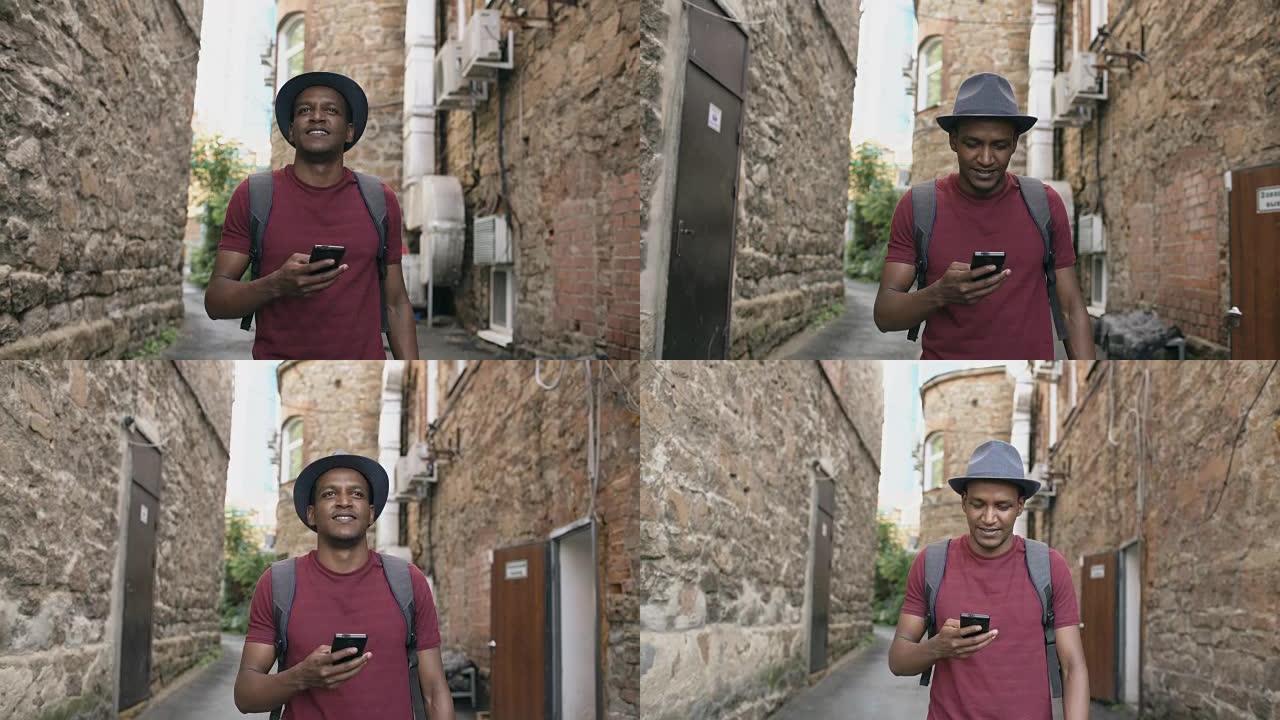 快乐的非洲裔美国学生在户外散步和使用智能手机应用程序