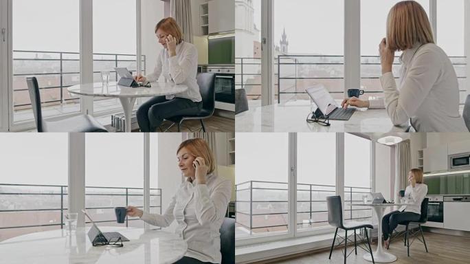 WS女商人在数字平板电脑上工作时在电话上聊天