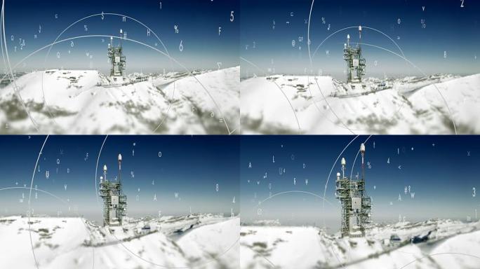 冬季山峰上的通讯塔象征着全球通信和监视