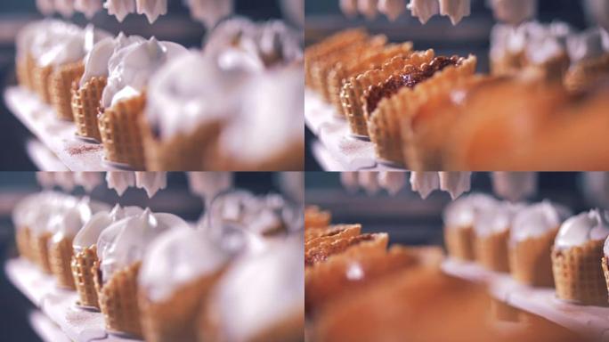 华夫饼蛋筒在特写镜头中充满了白色奶油