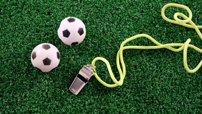 足球和裁判在人造草上吹口哨4k