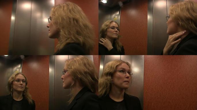 电梯里的商务女性电梯里的商务女性
