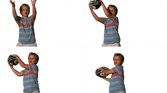 小男孩在白色背景上捕捉橄榄球球