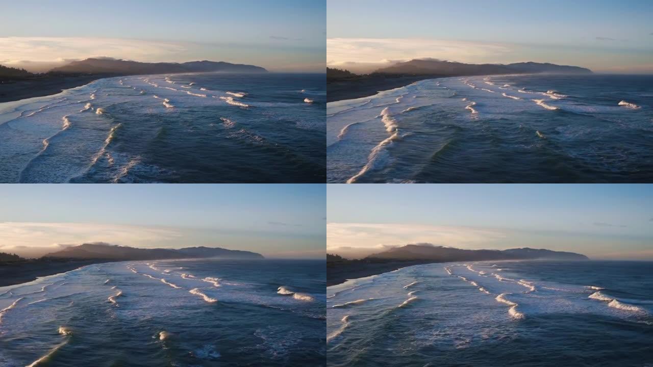 在太平洋西北部，海浪打破了戏剧性的海岸线，拥有惊人的日出光，在海滩上鸟瞰图