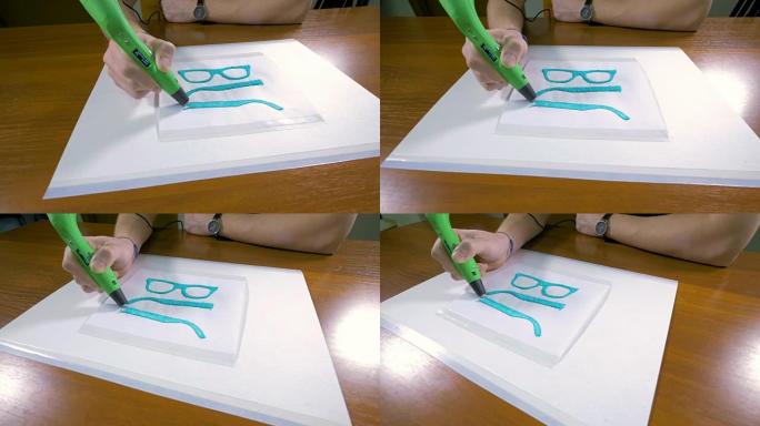 4K.男子手与3D笔打印眼镜。现代技术工艺。