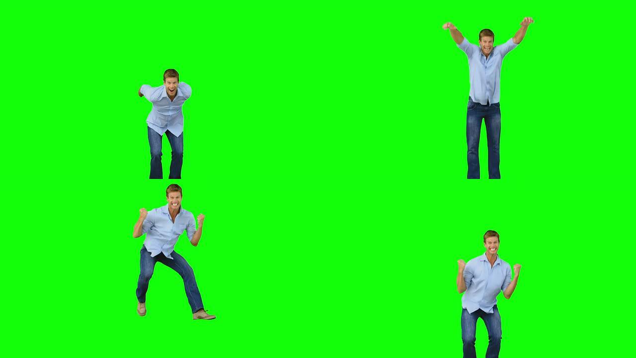 男子跳跃以在绿色屏幕上展示自己的胜利
