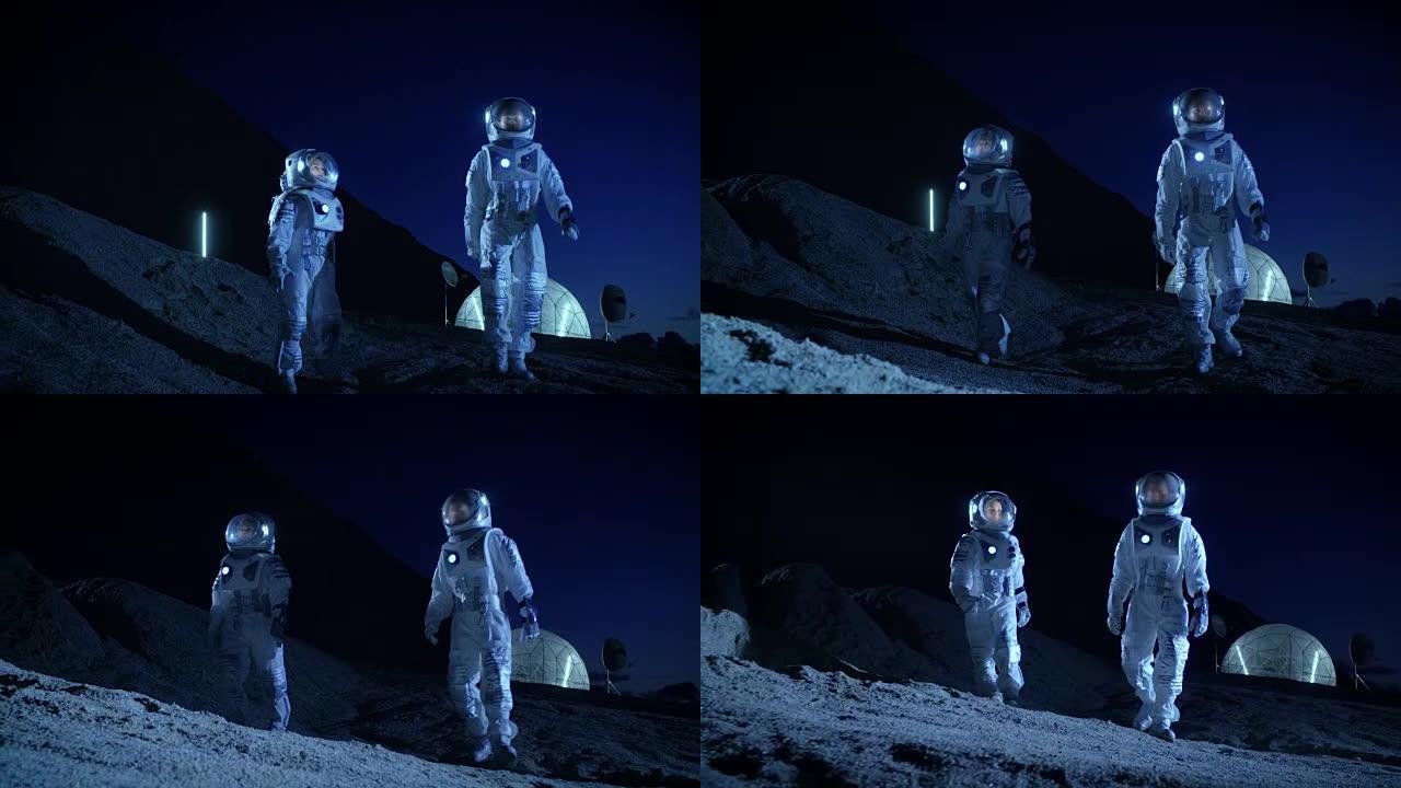 两名宇航员穿着宇航服探索新发现的行星。在背景空间基地。太空殖民的未来概念。