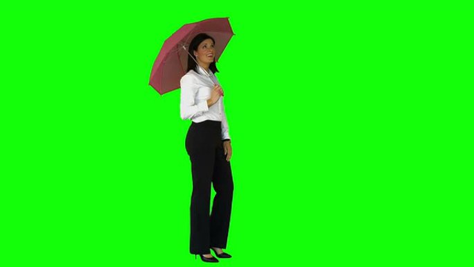 绿屏上戴着雨伞的女商人