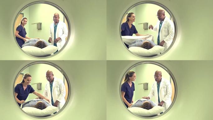医疗专业人员视图，患者通过CT扫描仪