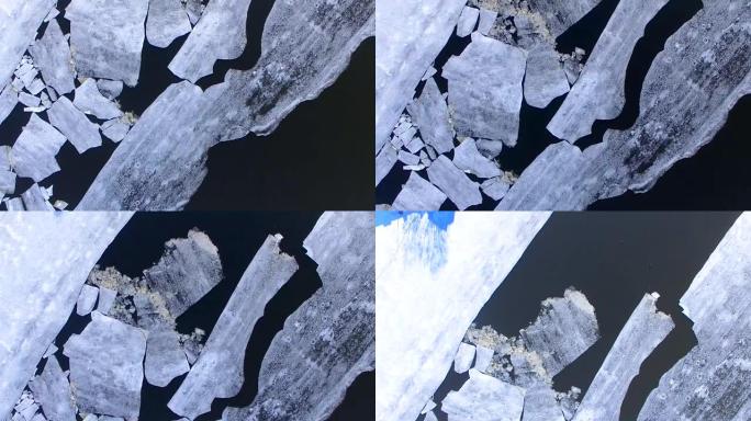 4K.空中竞争。相机经过一条结冰的河面，碎冰。