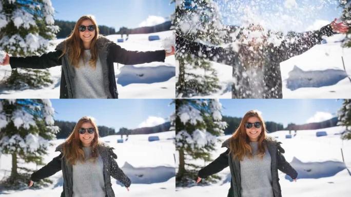 快乐的女人在雪地里玩耍
