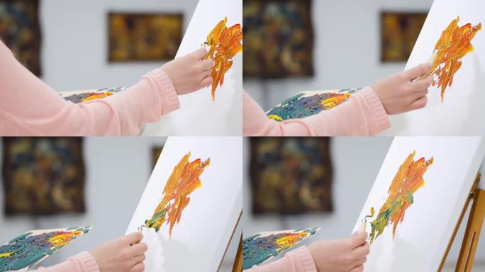 女艺术家开始在画布上画一幅画。美术馆背景。4K。