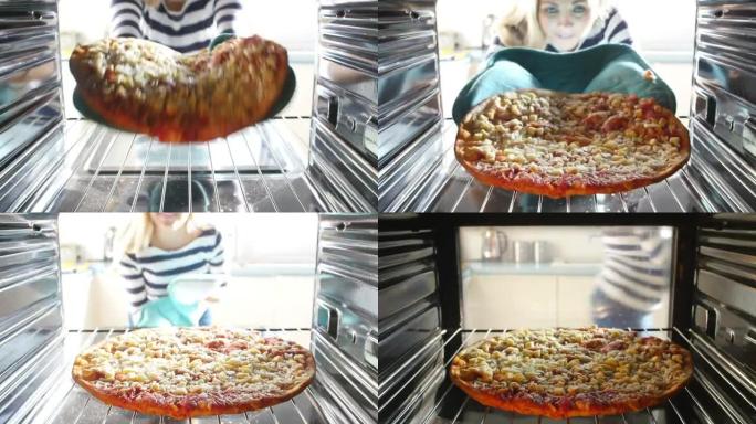 女人将意大利辣香肠比萨饼放入烤箱做饭
