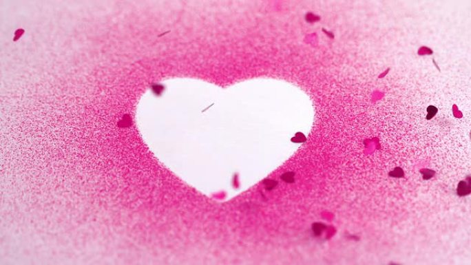 粉红色的小五彩纸屑落在白色的心上