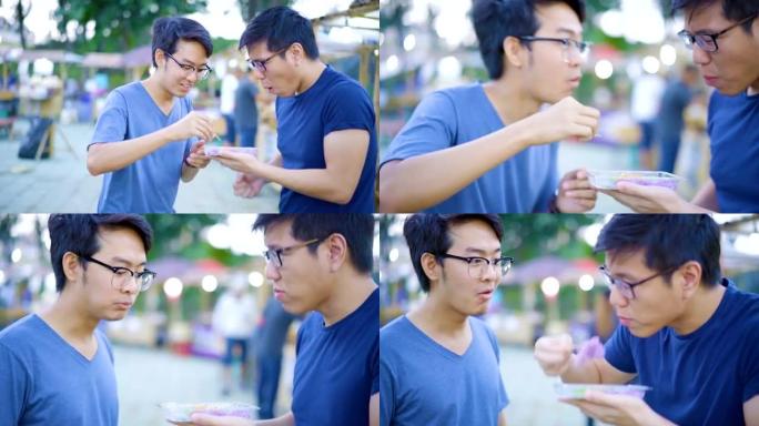 两名男子喜欢吃泰国街头美食